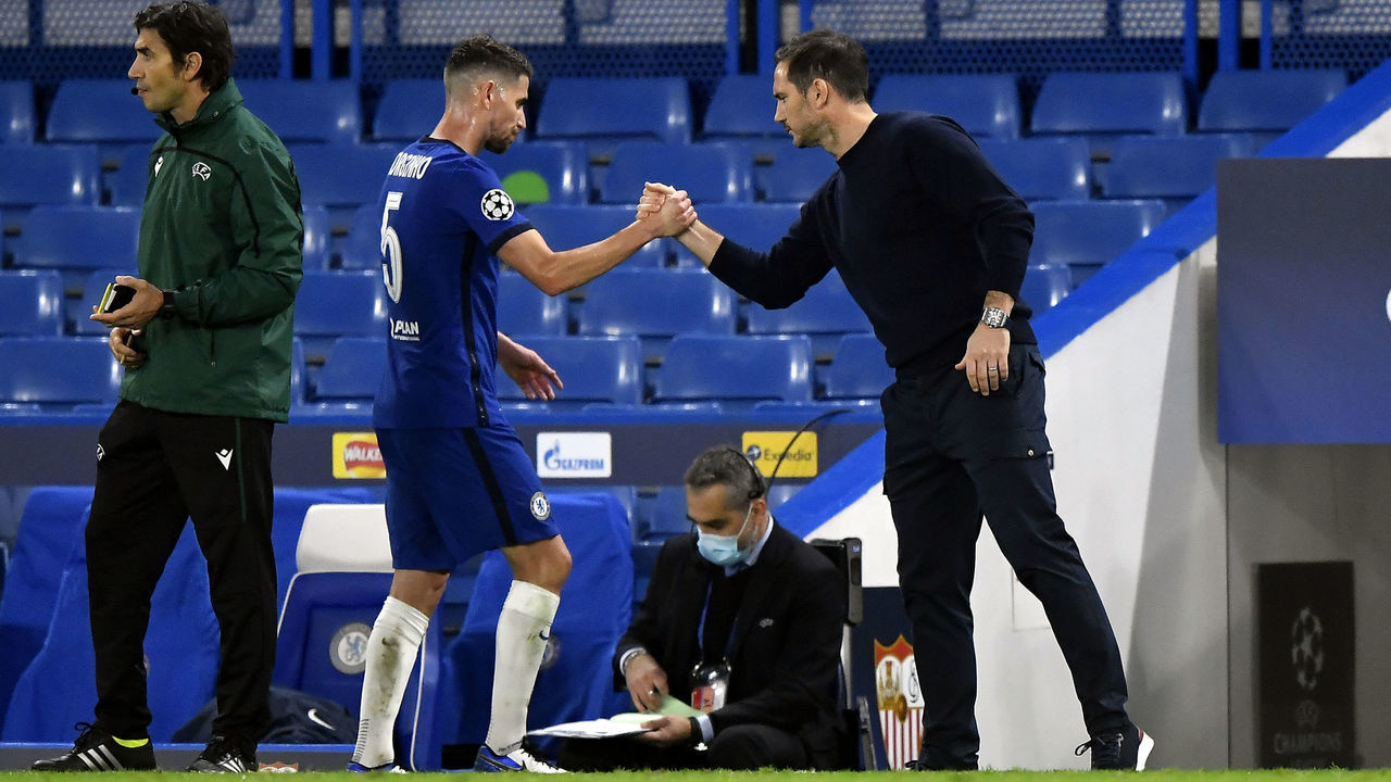 Chelsea's Jorginho shakes hands with manager Frank Lampard after being substituted during the UEFA Champions League match at Stamford Bridge, London.