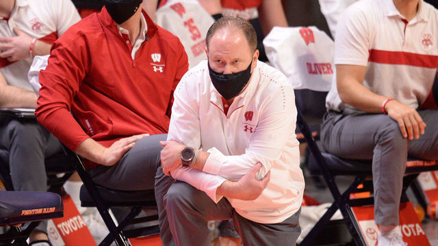 CHAMPAIGN, IL - FEBRUARY 06: Wisconsin Badgers head coach Greg Gard kneels by the team bench during the Big Ten Conference college basketball game between the Wisconsin Badgers and the Illinois Fighting Illini on February 6, 2021, at the Stat Farm Center in Champaign, Illinois.