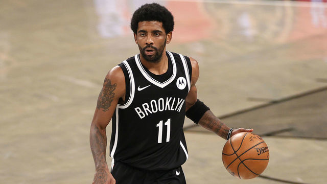 NEW YORK, NEW YORK - APRIL 23: Kyrie Irving #11 of the Brooklyn Nets dribbles during the second half against the Boston Celtics at Barclays Center on April 23, 2021 in the Brooklyn borough of New York City. The Nets won 109-104.