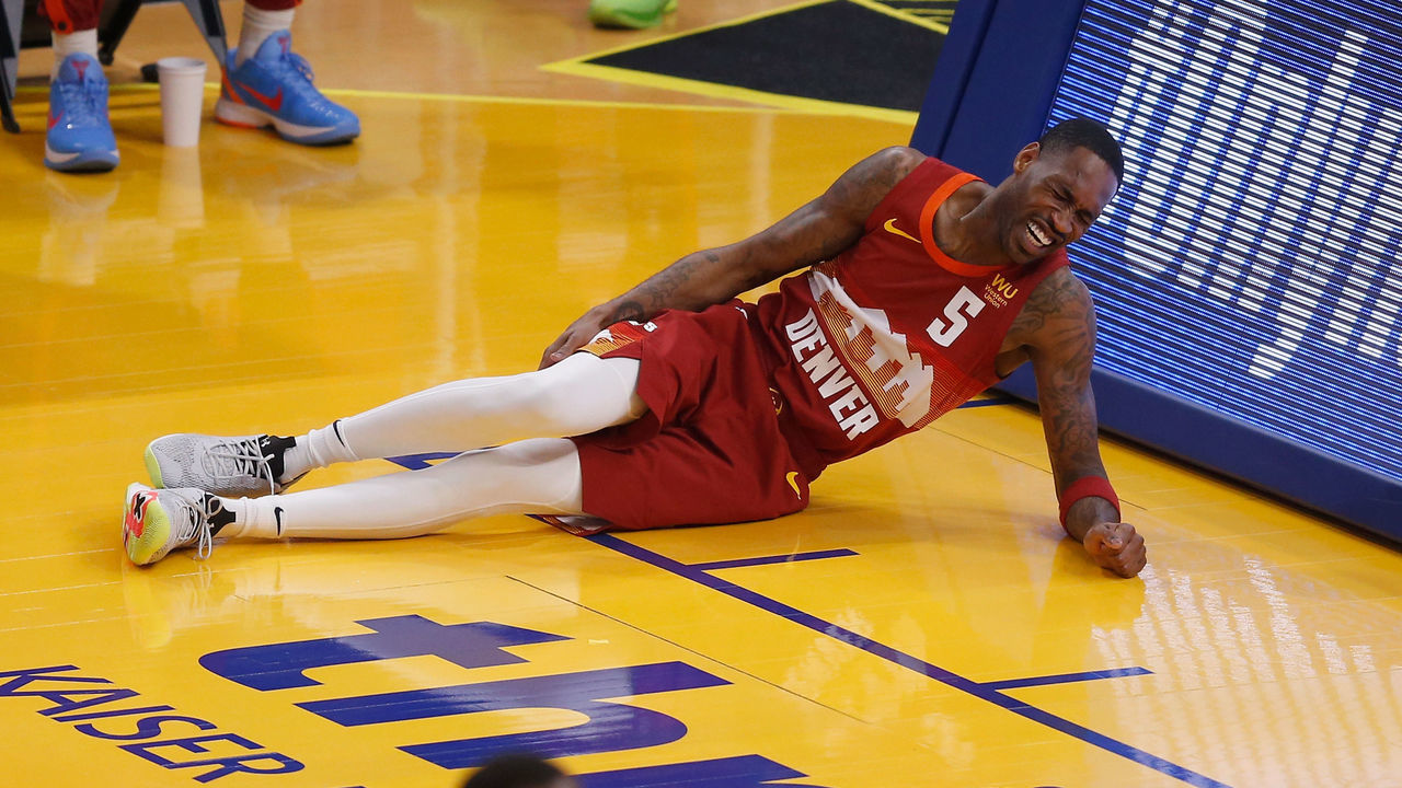 SAN FRANCISCO, CALIFORNIA - APRIL 23: Will Barton #5 of the Denver Nuggets grasps his leg after a play in the first quarter against the Golden State Warriors at Chase Center on April 23, 2021 in San Francisco, California.