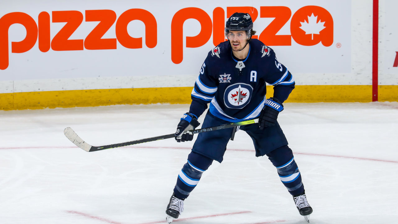 WINNIPEG, MB - APRIL 02: Mark Scheifele #55 of the Winnipeg Jets keeps an eye on the play during action in the overtime period against the Toronto Maple Leafs at Bell MTS Place on April 02, 2021 in Winnipeg, Manitoba.