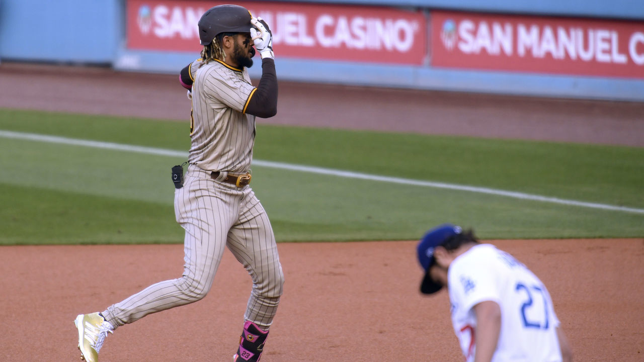 LOS ANGELES, CALIFORNIA - APRIL 24: Fernando Tatis Jr. #23 of the San Diego Padres celebrates his solo homerun in front of Trevor Bauer #27 of the Los Angeles Dodgers, to take a 1-0 lead, during the first inning at Dodger Stadium on April 24, 2021 in Los Angeles, California.