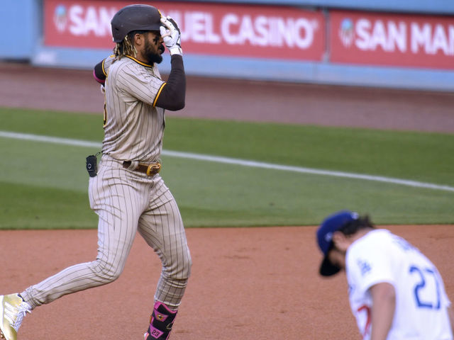 Download San Diego Padres' Fernando Tatis Jr. Enjoying a Home Run Wallpaper