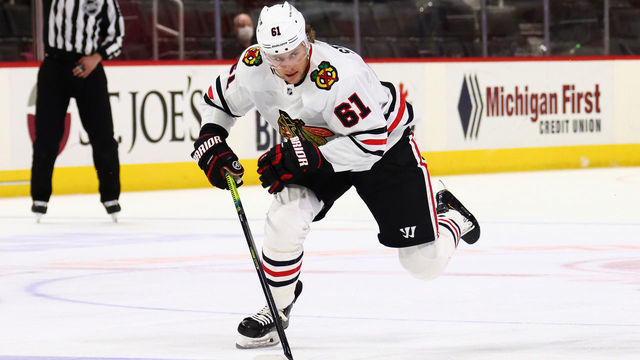 DETROIT, MICHIGAN - APRIL 15: Riley Stillman #61 of the Chicago Blackhawks skates against the Detroit Red Wings at Little Caesars Arena on April 15, 2021 in Detroit, Michigan.