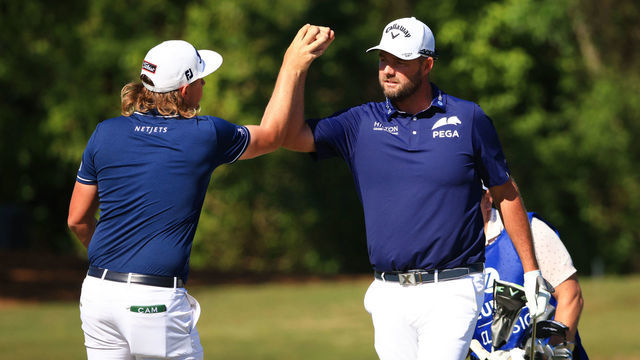 NEW ORLEANS, LOUISIANA - APRIL 25: Cameron Smith of Australia and Marc Leishman of Australia react to a birdie putt on the 16th green during the final round of the Zurich Classic of New Orleans at TPC Louisiana on April 25, 2021 in New Orleans, Louisiana.