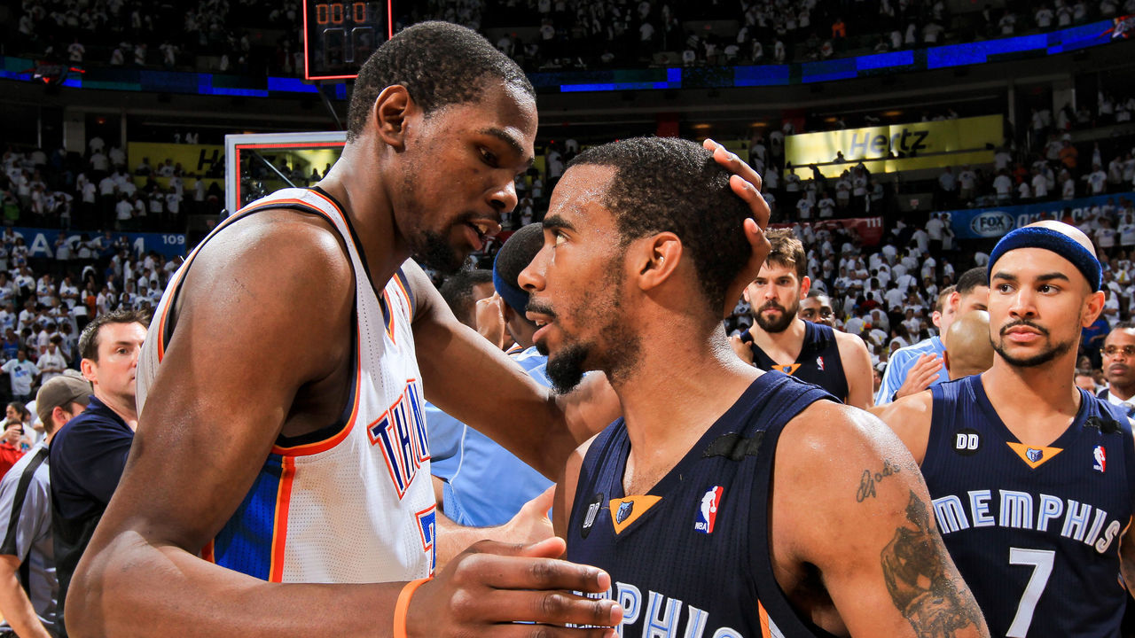 OKLAHOMA CITY, OK - MAY 15: Mike Conley #11 of the Memphis Grizzlies greets Kevin Durant #35 of the Oklahoma City Thunder following his team's series win against the Thunder in Game Five of the Western Conference Semifinals during the 2013 NBA Playoffs on May 15, 2013 at the Chesapeake Energy Arena in Oklahoma City, Oklahoma. Mandatory Copyright Notice: Copyright 2013 NBAE