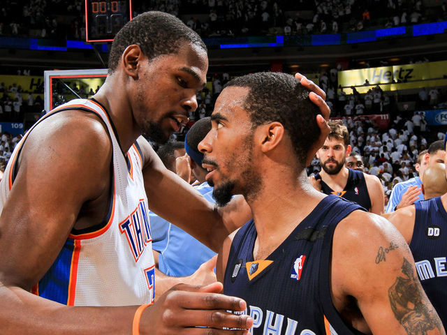 OKLAHOMA CITY, OK - MAY 15: Mike Conley #11 of the Memphis Grizzlies greets Kevin Durant #35 of the Oklahoma City Thunder following his team's series win against the Thunder in Game Five of the Western Conference Semifinals during the 2013 NBA Playoffs on May 15, 2013 at the Chesapeake Energy Arena in Oklahoma City, Oklahoma. Mandatory Copyright Notice: Copyright 2013 NBAE