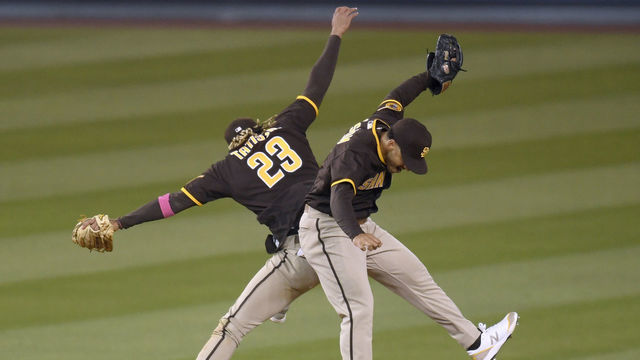 LOS ANGELES, CALIFORNIA - APRIL 25: Fernando Tatis Jr. #23 and Trent Grisham #2 of the San Diego Padres celebrate an 8-7 win over the Los Angeles Dodgers in eleventh innings at Dodger Stadium on April 25, 2021 in Los Angeles, California.