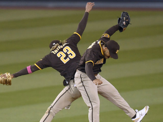 LOS ANGELES, CALIFORNIA - APRIL 25: Fernando Tatis Jr. #23 and Trent Grisham #2 of the San Diego Padres celebrate an 8-7 win over the Los Angeles Dodgers in eleventh innings at Dodger Stadium on April 25, 2021 in Los Angeles, California.