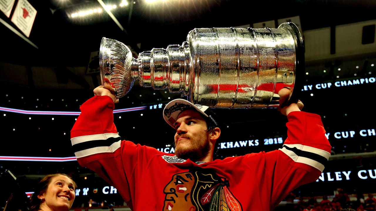 CHICAGO, IL - JUNE 15: Andrew Shaw #65 of the Chicago Blackhawks celebrates with the Stanley Cup after defeating the Tampa Bay Lightning by a score of 2-0 in Game Six to win the 2015 NHL Stanley Cup Final at the United Center on June 15, 2015 in Chicago, Illinois.