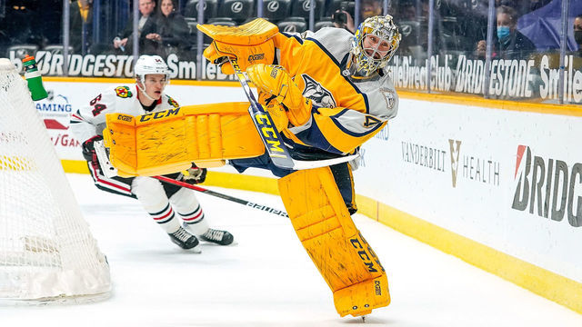 NASHVILLE, TN - APRIL 19: Juuse Saros #74 of the Nashville Predators plays the puck against the Chicago Blackhawks at Bridgestone Arena on April 19, 2021 in Nashville, Tennessee.