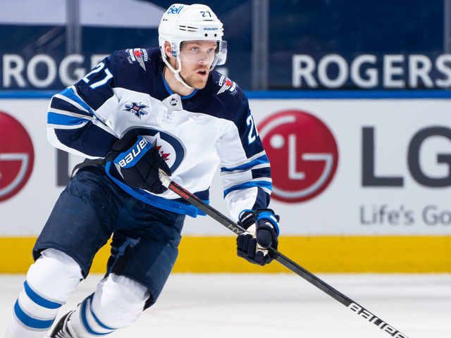 TORONTO, ON - APRIL 15: Nikolaj Ehlers #27 of the Winnipeg Jets skates with the puck against the Toronto Maple Leafs during the first period at the Scotiabank Arena on April 15, 2021 in Toronto, Ontario, Canada.