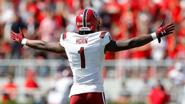 ATHENS, GEORGIA - OCTOBER 12: Jaycee Horn #1 of the South Carolina Gamecocks reacts as Israel Mukuamu #24 returns an interception for a touchdown in the first half against the Georgia Bulldogs at Sanford Stadium on October 12, 2019 in Athens, Georgia.