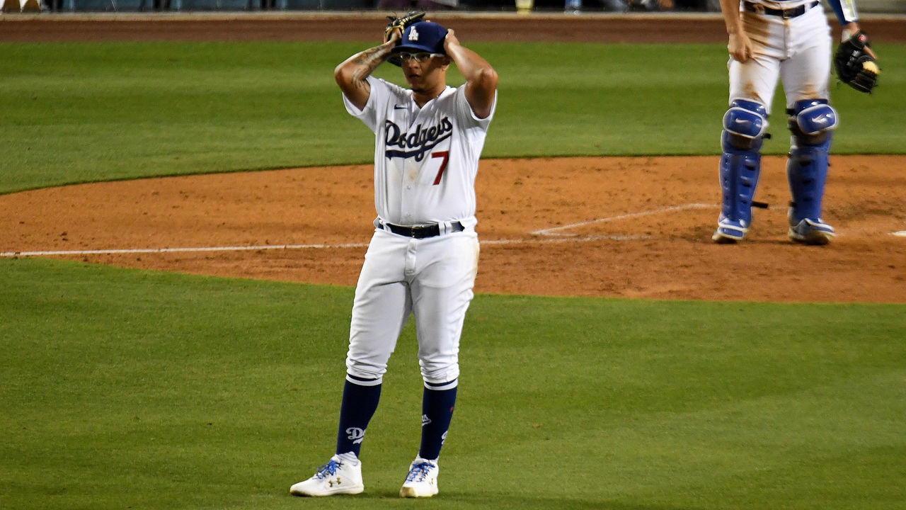 Los Angeles, CA - April 10: Starting pitcher Julio Urias #7 of the Los Angeles Dodgers reacts after giving up a run against the Washington Nationals in the sixth inning of a baseball game at Dodger Stadium in Los Angeles on Saturday, April 10, 2021.