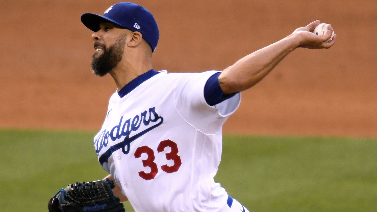 LOS ANGELES, CALIFORNIA - APRIL 25: David Price #33 of the Los Angeles Dodgers pitches in relief during the seventh inning against the San Diego Padres at Dodger Stadium on April 25, 2021 in Los Angeles, California.