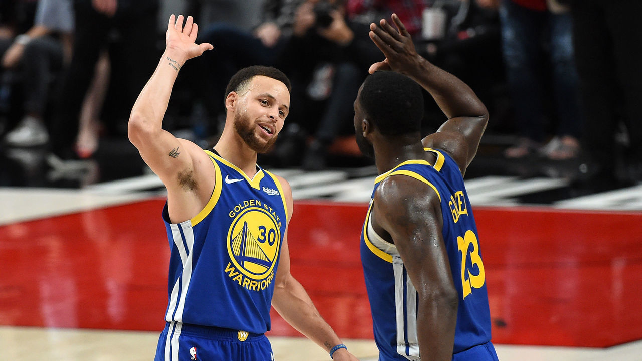 PORTLAND, OREGON - MAY 18: Stephen Curry #30 of the Golden State Warriors celebrates with Draymond Green #23 during the second half against the Portland Trail Blazers in game three of the NBA Western Conference Finals at Moda Center on May 18, 2019 in Portland, Oregon.
