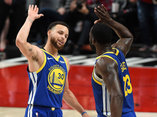 PORTLAND, OREGON - MAY 18: Stephen Curry #30 of the Golden State Warriors celebrates with Draymond Green #23 during the second half against the Portland Trail Blazers in game three of the NBA Western Conference Finals at Moda Center on May 18, 2019 in Portland, Oregon.