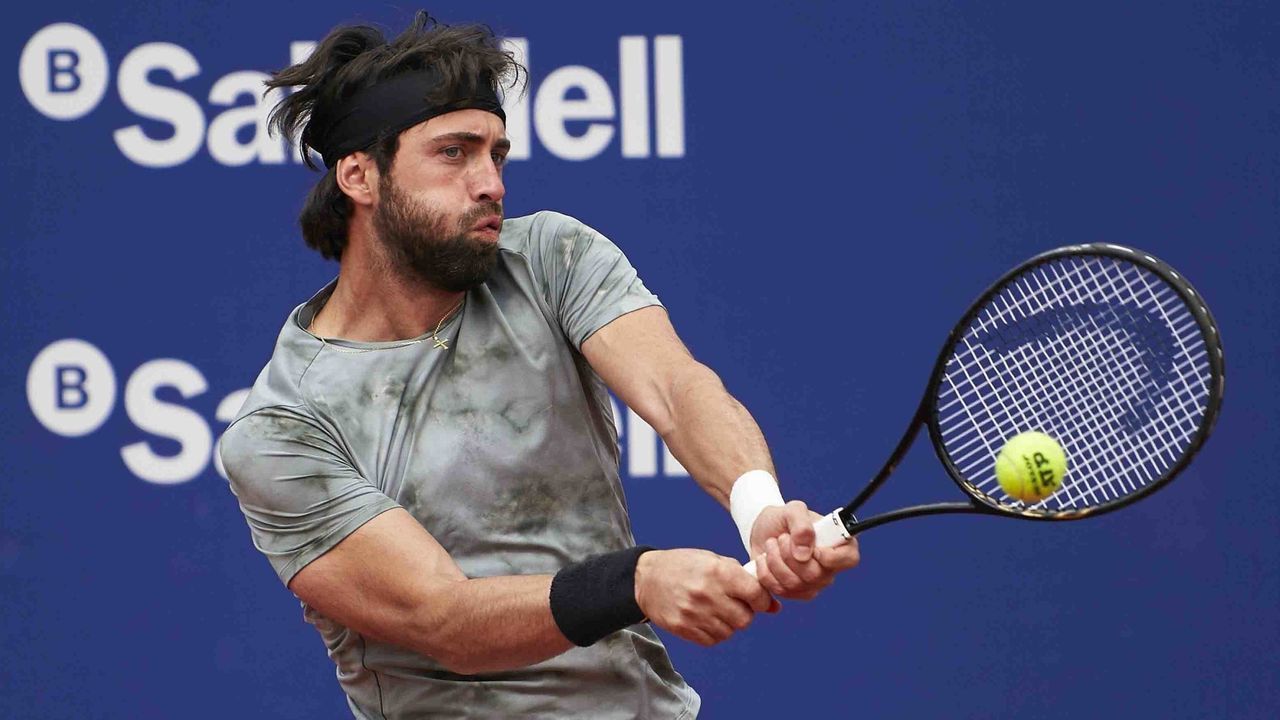 BARCELONA, SPAIN - APRIL 19: Nikoloz Basilashvili of Georgia returns the ball during his match against Jeremy Chardy of France on day three of the Barcelona Open Banc Sabadell 2021 at Real Club De Tenis Barcelona on April 19, 2021 in Barcelona, Spain.