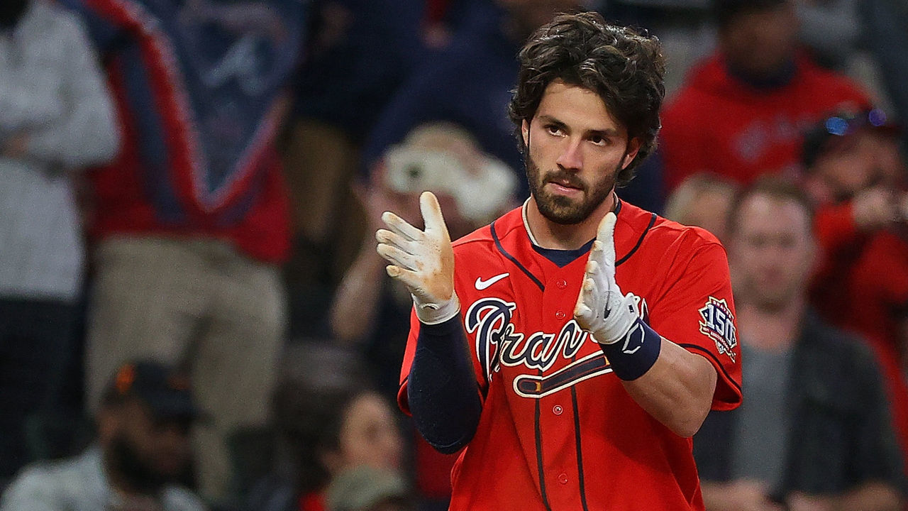 ATLANTA, GEORGIA - APRIL 23: Dansby Swanson #7 of the Atlanta Braves reacts after hitting a RBI triple in the fifth inning to score Marcell Ozuna #20 against the Arizona Diamondbacks at Truist Park on April 23, 2021 in Atlanta, Georgia.