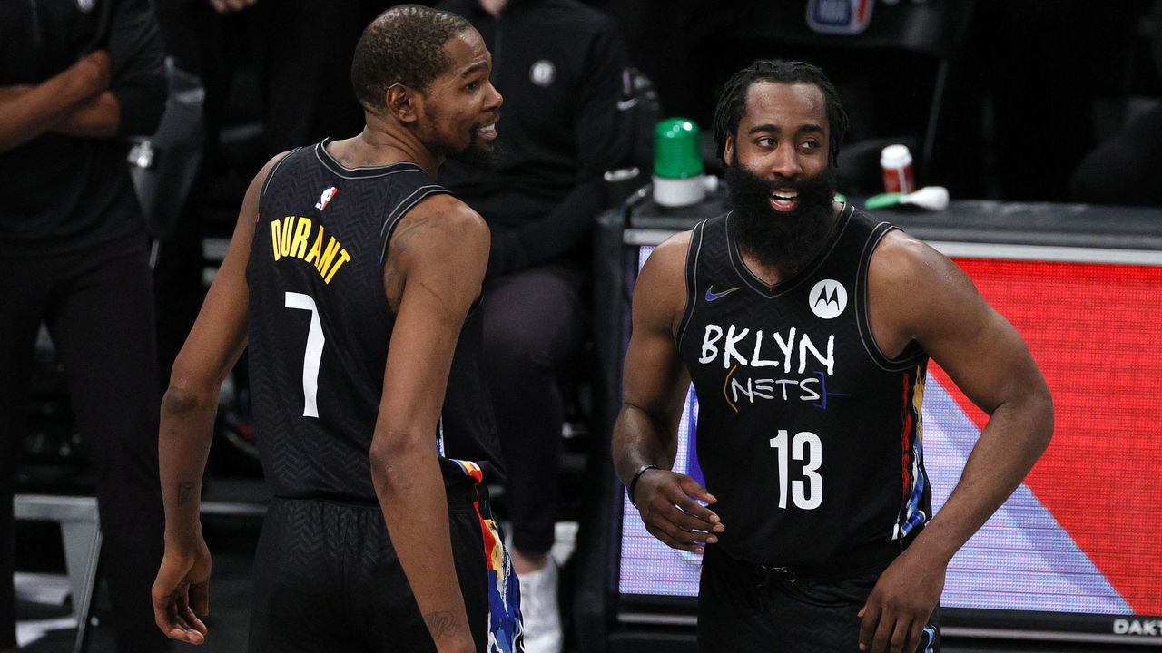 NEW YORK, NEW YORK - FEBRUARY 02: Kevin Durant #7 and James Harden #13 of the Brooklyn Nets react during the second half against the LA Clippers at Barclays Center on February 02, 2021 in the Brooklyn borough of New York City. The Nets won 124-120.