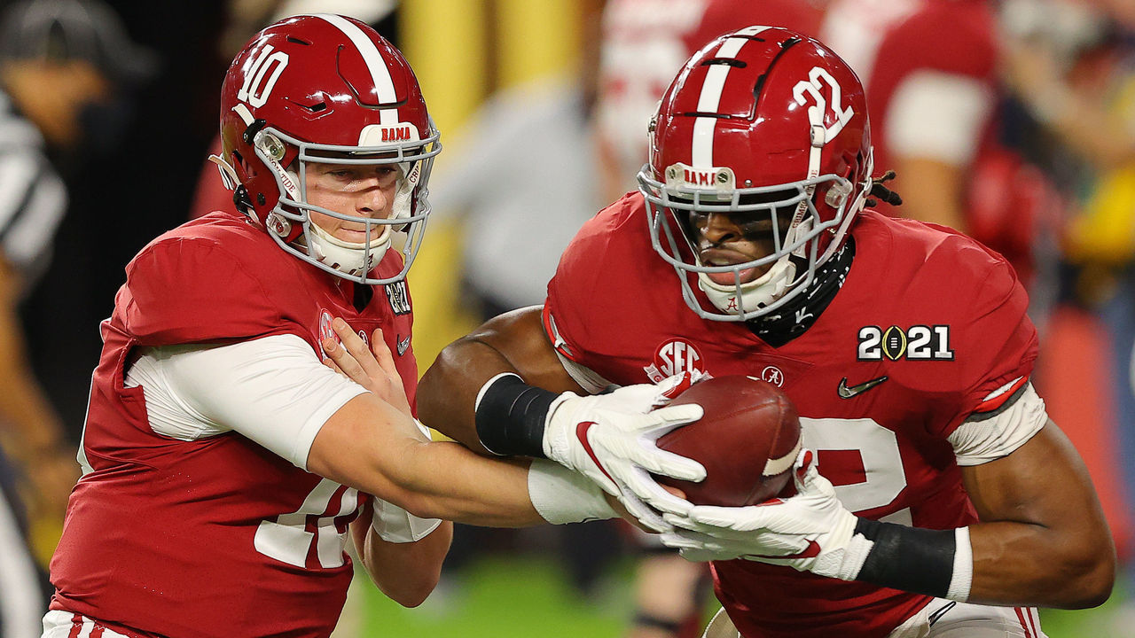 MIAMI GARDENS, FLORIDA - JANUARY 11: Mac Jones #10 and Najee Harris #22 of the Alabama Crimson Tide warm up prior to the College Football Playoff National Championship game against the Ohio State Buckeyes at Hard Rock Stadium on January 11, 2021 in Miami Gardens, Florida.