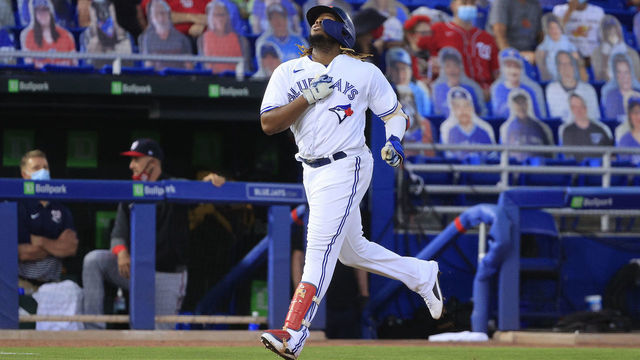 DUNEDIN, FLORIDA - APRIL 27: Vladimir Guerrero Jr. #27 of the Toronto Blue Jays reacts to his a grand-slam home run in the third inning against the Washington Nationals at TD Ballpark on April 27, 2021 in Dunedin, Florida.