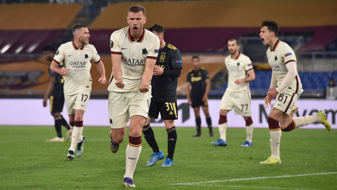 ROME, ITALY - APRIL 15: Edin Dzeko of Roma celebrates after scoring their team's first goal during the UEFA Europa League Quarter Final Second Leg match between AS Roma and Ajax at Stadio Olimpico on April 15, 2021 in Rome, Italy. Sporting stadiums around Europe remain under strict restrictions due to the Coronavirus Pandemic as Government social distancing laws prohibit fans inside venues resulting in games being played behind closed doors.