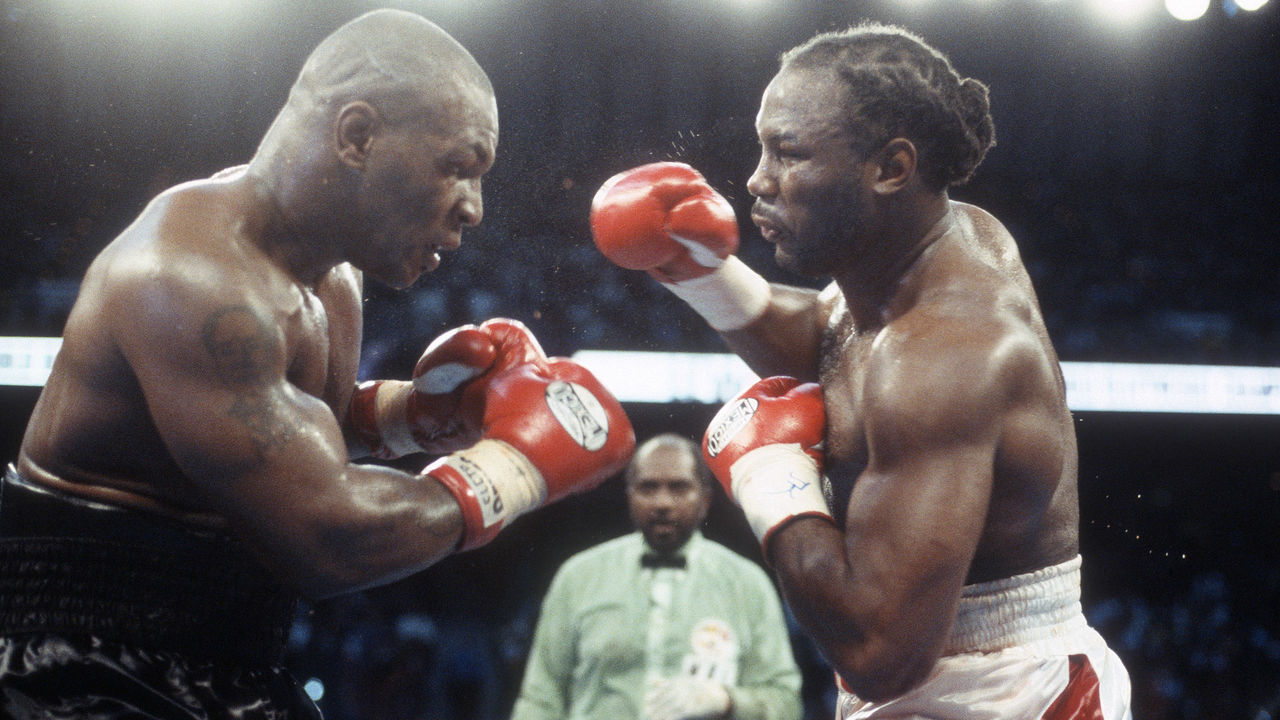 MEMPHIS, TN - JUNE 8: Lennox Lewis and Mike Tyson fight for the WBC, IBO, IBF, Ring and Lineal heavyweight titles on June 8, 2002 at The Pyramid in Memphis, Tennessee. Lewis won the fight with an 8th round KO.