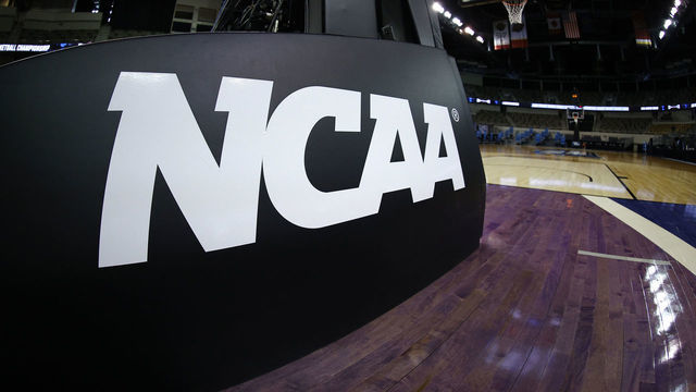 INDIANAPOLIS, INDIANA - MARCH 21: The NCAA logo is seen on the basket stanchion before the game between the Oral Roberts Golden Eagles and the Florida Gators in the second round game of the 2021 NCAA Men's Basketball Tournament at Indiana Farmers Coliseum on March 21, 2021 in Indianapolis, Indiana.