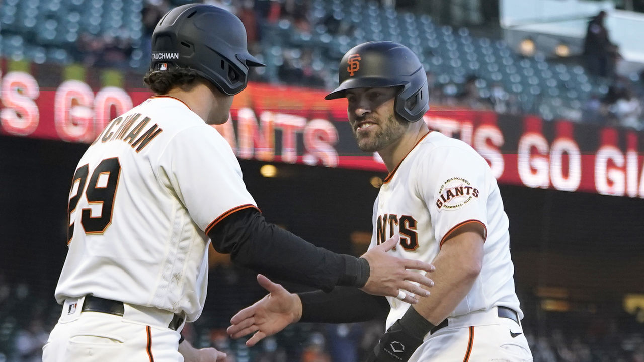 SAN FRANCISCO, CALIFORNIA - APRIL 28: Mike Tauchman #29 and Curt Casali #2 of the San Francisco Giants celebrate after they both scored on a bases loaded two-run RBI single from Brandon Belt #9 against the Colorado Rockies in the second inning at Oracle Park on April 28, 2021 in San Francisco, California.