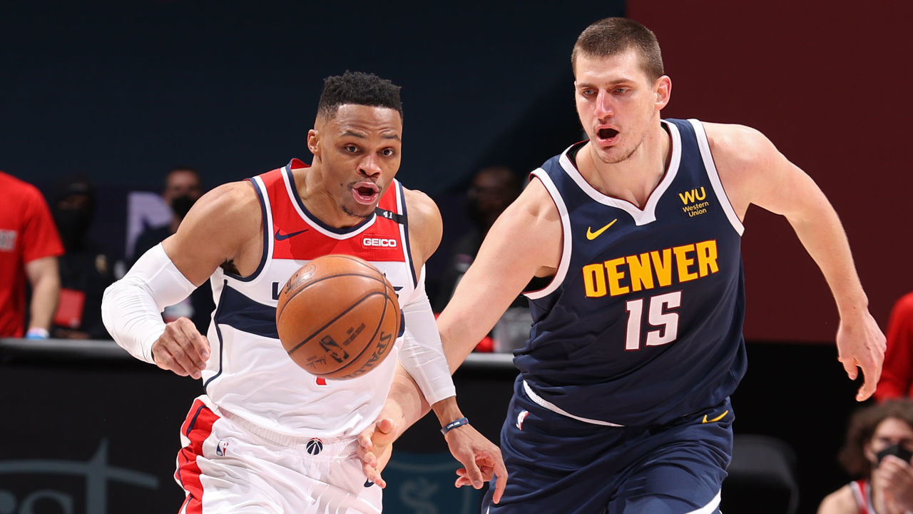 WASHINGTON, DC - FEBRUARY 17: Russell Westbrook #4 of the Washington Wizards and Nikola Jokic #15 of the Denver Nuggets go for a loose ball on February 17, 2021 at Capital One Arena in Washington, DC. Mandatory Copyright Notice: Copyright 2021 NBAE