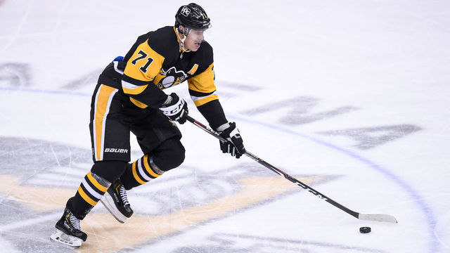 PITTSBURGH, PA - MARCH 06: Pittsburgh Penguins Center Evgeni Malkin (71) skates with the puck during the third period in the NHL game between the Pittsburgh Penguins and the Philadelphia Flyers on March 6, 2021, at PPG Paints Arena in Pittsburgh, PA.