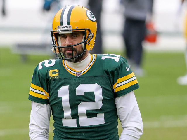 GREEN BAY, WISCONSIN - JANUARY 24: Aaron Rodgers #12 of the Green Bay Packers warms up before the NFC Championship game against the Tampa Bay Buccaneers at Lambeau Field on January 24, 2021 in Green Bay, Wisconsin.