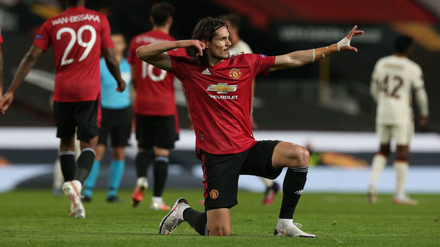 MANCHESTER, ENGLAND - APRIL 29: Edinson Cavani of Manchester United celebrates scoring their third goal during the UEFA Europa League Semi-final First Leg match between Manchester United and AS Roma at Old Trafford on April 29, 2021 in Manchester, England. Sporting stadiums around Europe remain under strict restrictions due to the Coronavirus Pandemic as Government social distancing laws prohibit fans inside venues resulting in games being played behind closed doors.