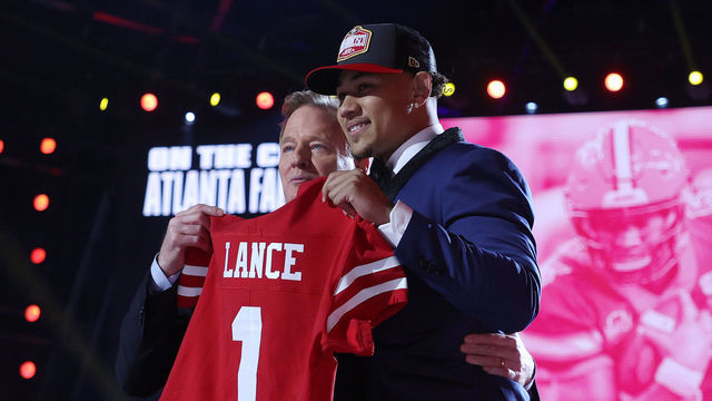 CLEVELAND, OHIO - APRIL 29: Trey Lance poses with NFL Commissioner Roger Goodell onstage after being selected third by the San Francisco 49ers during round one of the 2021 NFL Draft at the Great Lakes Science Center on April 29, 2021 in Cleveland, Ohio.