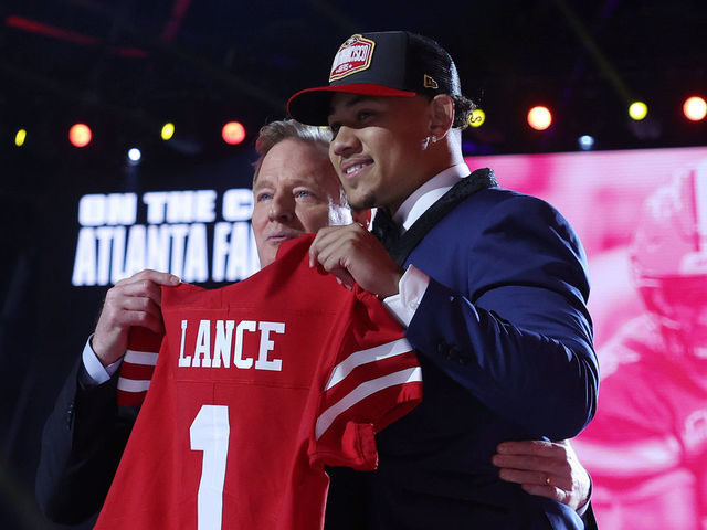 CLEVELAND, OHIO - APRIL 29: Trey Lance poses with NFL Commissioner Roger Goodell onstage after being selected third by the San Francisco 49ers during round one of the 2021 NFL Draft at the Great Lakes Science Center on April 29, 2021 in Cleveland, Ohio.