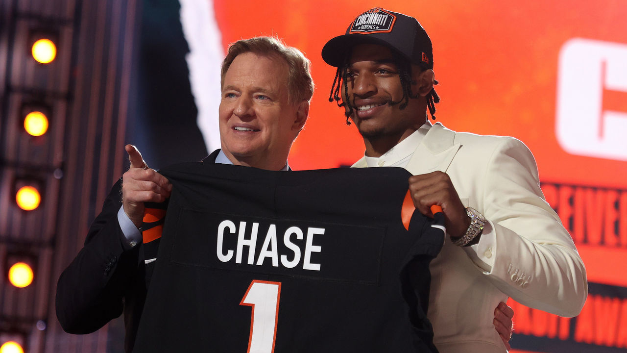 CLEVELAND, OHIO - APRIL 29: Ja'Marr Chase poses with NFL Commissioner Roger Goodell onstage after being selected fifth by the Cincinnati Bengals during round one of the 2021 NFL Draft at the Great Lakes Science Center on April 29, 2021 in Cleveland, Ohio.