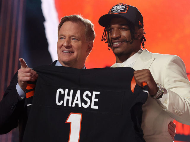CLEVELAND, OHIO - APRIL 29: Ja'Marr Chase poses with NFL Commissioner Roger Goodell onstage after being selected fifth by the Cincinnati Bengals during round one of the 2021 NFL Draft at the Great Lakes Science Center on April 29, 2021 in Cleveland, Ohio.