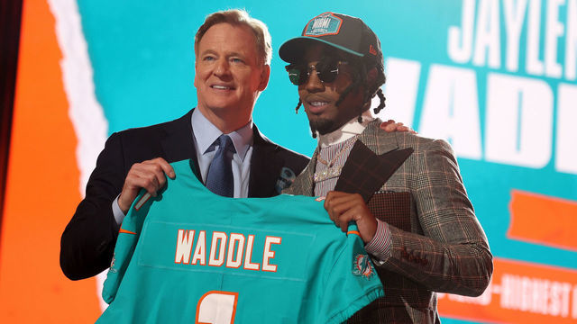 CLEVELAND, OHIO - APRIL 29: Jaylen Waddle poses with NFL Commissioner Roger Goodell onstage after being selected with the sixth pick by the Miami Dolphins during round one of the 2021 NFL Draft at the Great Lakes Science Center on April 29, 2021 in Cleveland, Ohio.