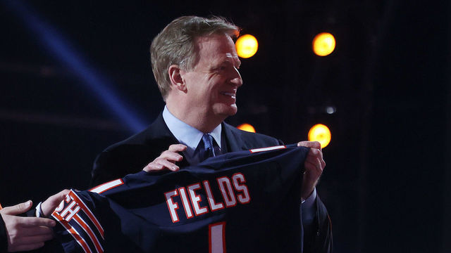 CLEVELAND, OHIO - APRIL 29: A fan holds a jersey with NFL Commissioner Roger Goodell after Justin Fields was selected 11th by the Chicago Bears during round one of the 2021 NFL Draft at the Great Lakes Science Center on April 29, 2021 in Cleveland, Ohio.