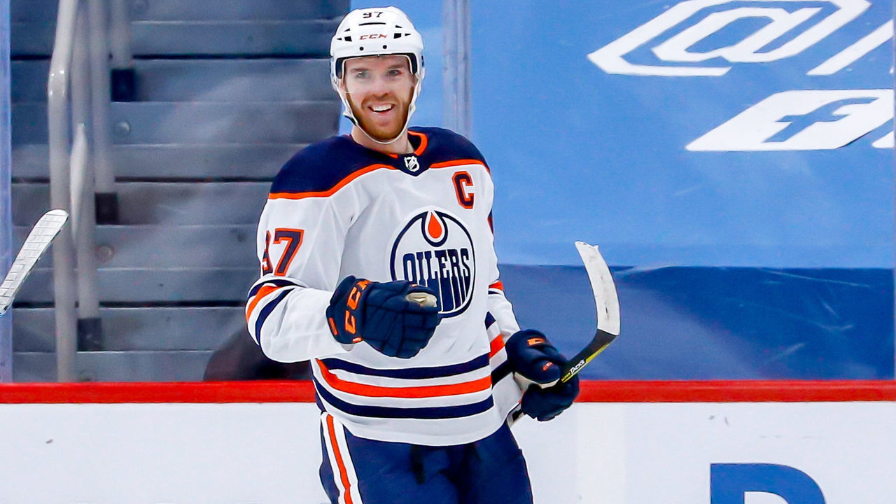 WINNIPEG, MB - APRIL 26: Connor McDavid #97 of the Edmonton Oilers is all smiles as he celebrates his first period goal against the Winnipeg Jets at the Bell MTS Place on April 26, 2021 in Winnipeg, Manitoba, Canada.