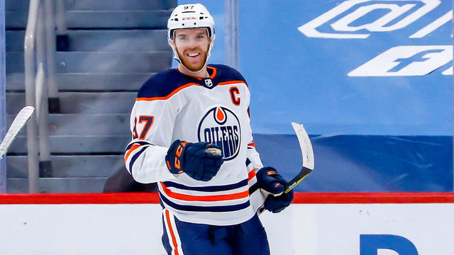 WINNIPEG, MB - APRIL 26: Connor McDavid #97 of the Edmonton Oilers is all smiles as he celebrates his first period goal against the Winnipeg Jets at the Bell MTS Place on April 26, 2021 in Winnipeg, Manitoba, Canada.