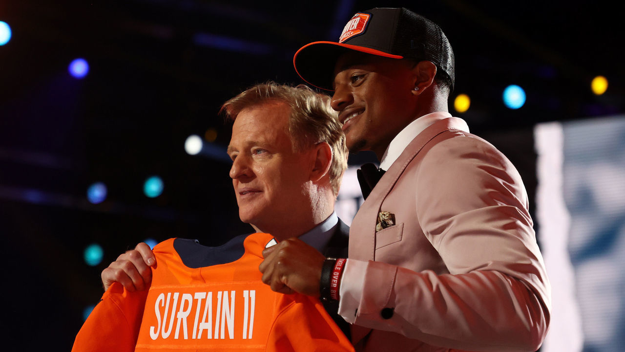 CLEVELAND, OHIO - APRIL 29: Patrick Surtain II poses with NFL Commissioner Roger Goodell onstage after being selected ninth by the Denver Broncos during round one of the 2021 NFL Draft at the Great Lakes Science Center on April 29, 2021 in Cleveland, Ohio.