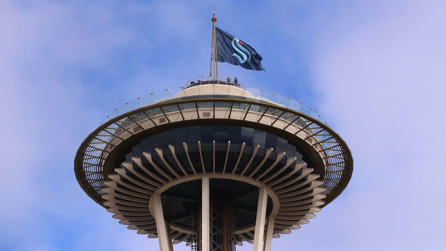 SEATTLE, WASHINGTON - JULY 23: A general view of the Space Needle as the Seattle Kraken team flag is hung from above on July 23, 2020 in Seattle, Washington. The NHL revealed the franchise's new team name today.