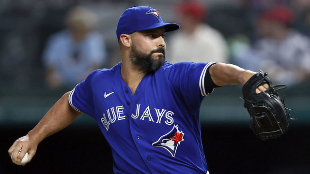 ARLINGTON, TEXAS - APRIL 06: Tanner Roark #14 of the Toronto Blue Jays pitches against the Texas Rangers in the bottom of the first inning at Globe Life Field on April 06, 2021 in Arlington, Texas.