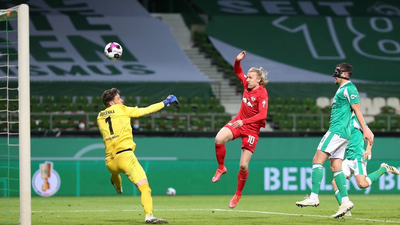 Leipzig's Swedish midfielder Emil Forsberg (C) scores the 1-2 goal past Bremen's Czech goalkeeper Jiri Pavlenka during the German Cup (DFB Pokal) semi-final football match Werder Bremen v RB Leipzig in Bremen, northern Germany on April 30, 2021. - - DFB REGULATIONS PROHIBIT ANY USE OF PHOTOGRAPHS AS IMAGE SEQUENCES AND QUASI-VIDEO.