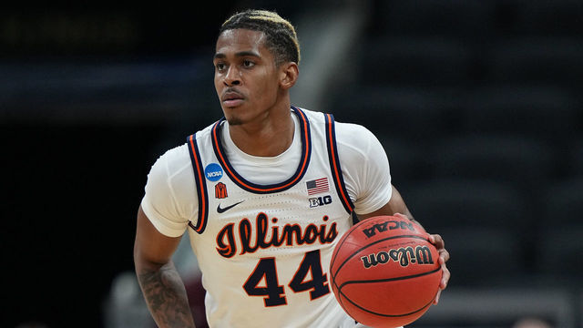 INDIANAPOLIS, IN - MARCH 21: Adam Miller #44 of the Illinois Fighting Illini brings the ball up the court against the Loyola Ramblers in the second round of the 2021 NCAA Division I Mens Basketball Tournament held at Bankers Life Fieldhouse on March 21, 2021 in Indianapolis, Indiana.