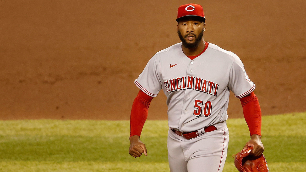 PHOENIX, ARIZONA - APRIL 09: Relief pitcher Amir Garrett #50 of the Cincinnati Reds reacts after defeating the Arizona Diamondbacks in the MLB game at Chase Field on April 09, 2021 in Phoenix, Arizona. The Reds defeated the Diamondbacks 6-5 in 10 innings.