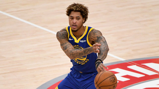 WASHINGTON, DC - APRIL 21: Kelly Oubre Jr. #12 of the Golden State Warriors passes against the Washington Wizards during the second half at Capital One Arena on April 21, 2021 in Washington, DC.