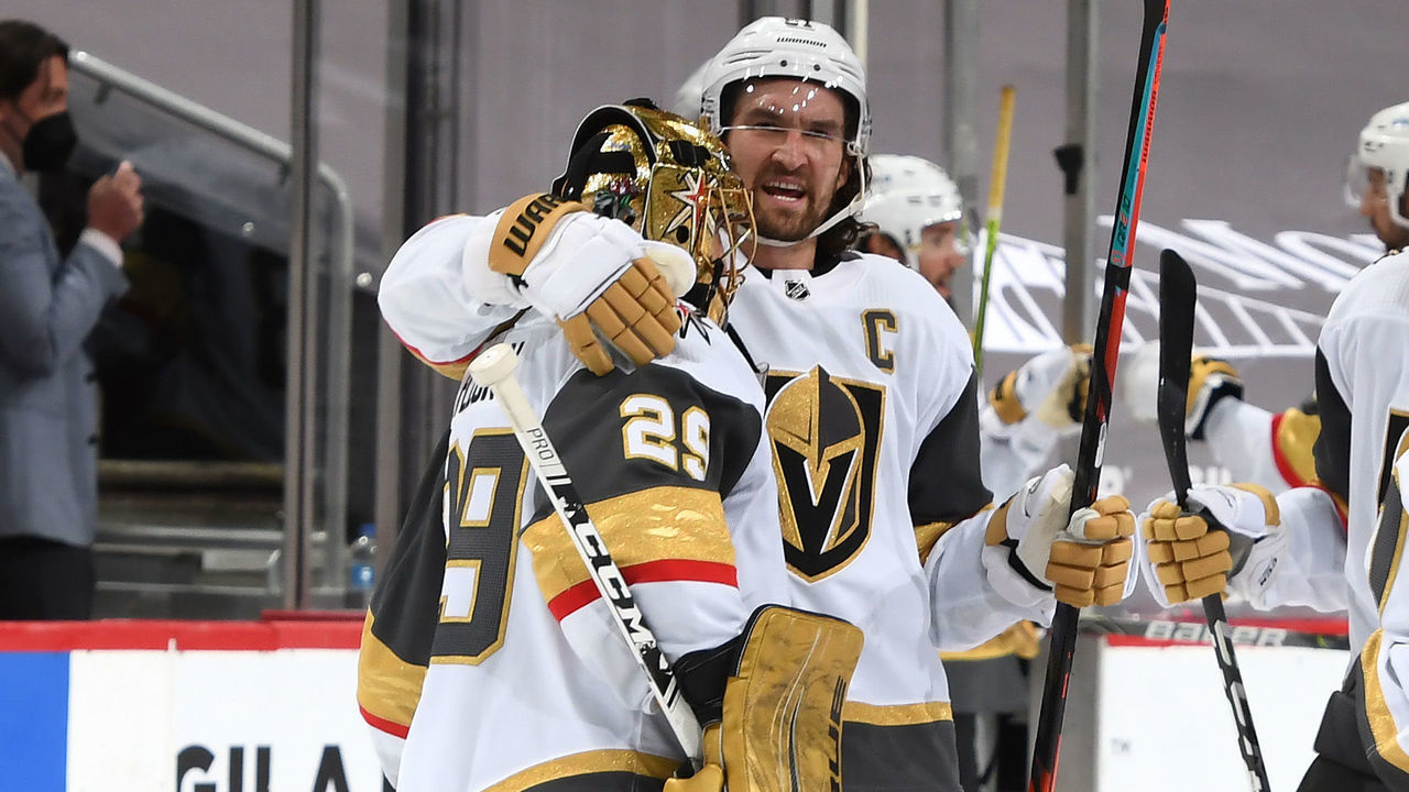 GLENDALE, ARIZONA - MAY 01: Goalie Marc-Andre Fleury #29 of the Vegas Golden Knights is congratulated by Mark Stone #61 of the Golden Knights after a 3-2 overtime victory against the Arizona Coyotes during the NHL hockey game at Gila River Arena on May 01, 2021 in Glendale, Arizona.